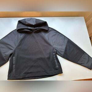 Athleta black cropped hoodie. Satin arm and hood patches. Size L.